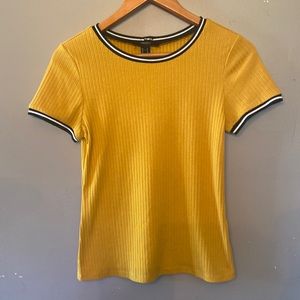 Forever 21 sweater shirt yellow with black and white striped sleeve and collar.